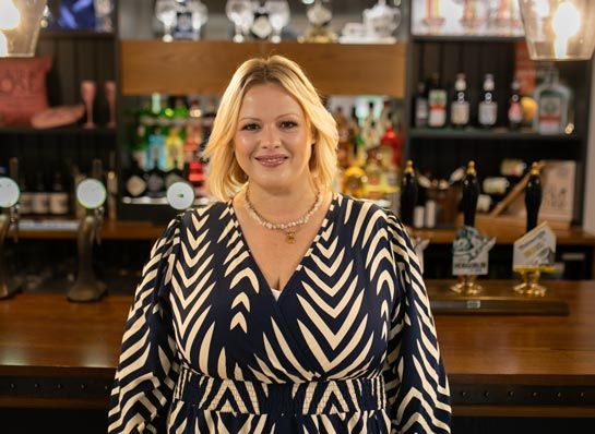 Bethan Raybould standing at a bar