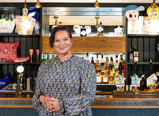 Photo of Bridget Lea standing at a bar