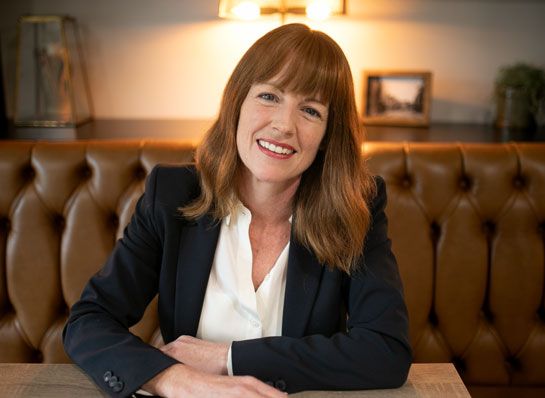 Mags Dixon sitting at a table