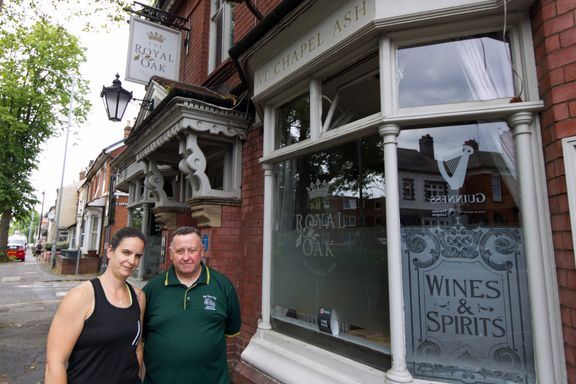 Emma and Terry standing outside The Royal Oak