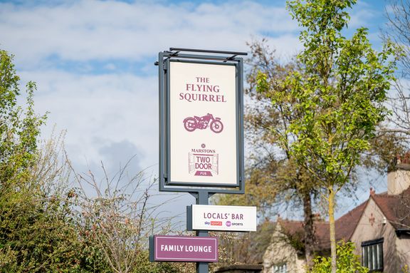 A pub sign for The Flying Squirrel