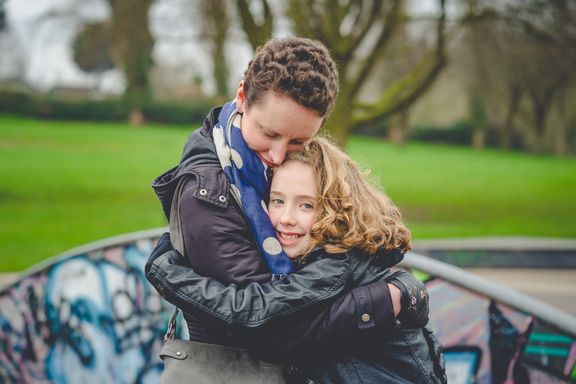 A woman and child hugging