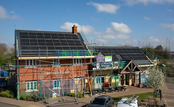 Solar panels being installed on the Paisley Pear pub