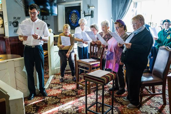 People standing at a remembrance event