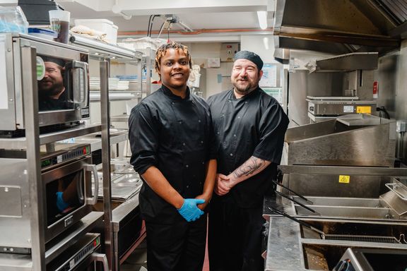 Two chefs in a pub kitchen